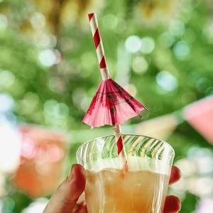 A cocktail with a paper umbrella